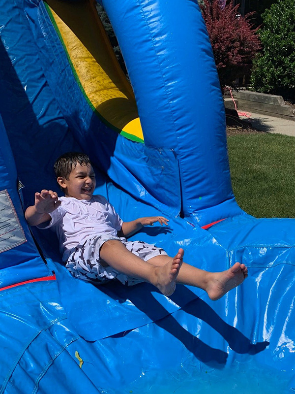 Mini-Miracles Early Education & Child Care Center: Playing on a Water Slide